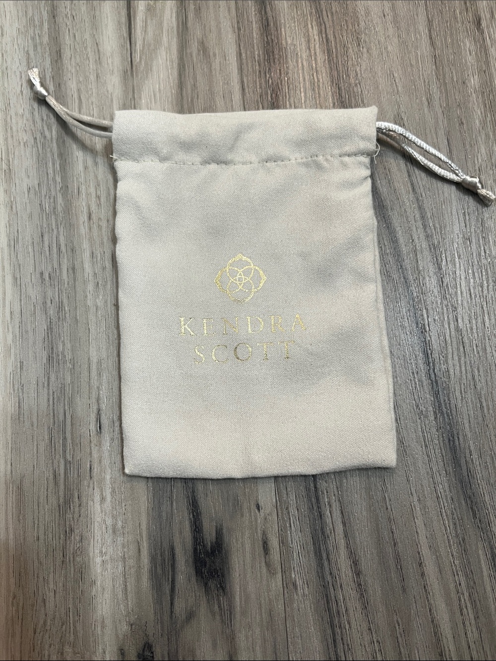 Kendra Scott Small Drawstring Jewelry Pouch in Beige with Gold Logo
